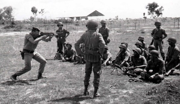 A U.S. Special Forces advisor providing ARVN troops with instruction on using the Thompson in October 1962.