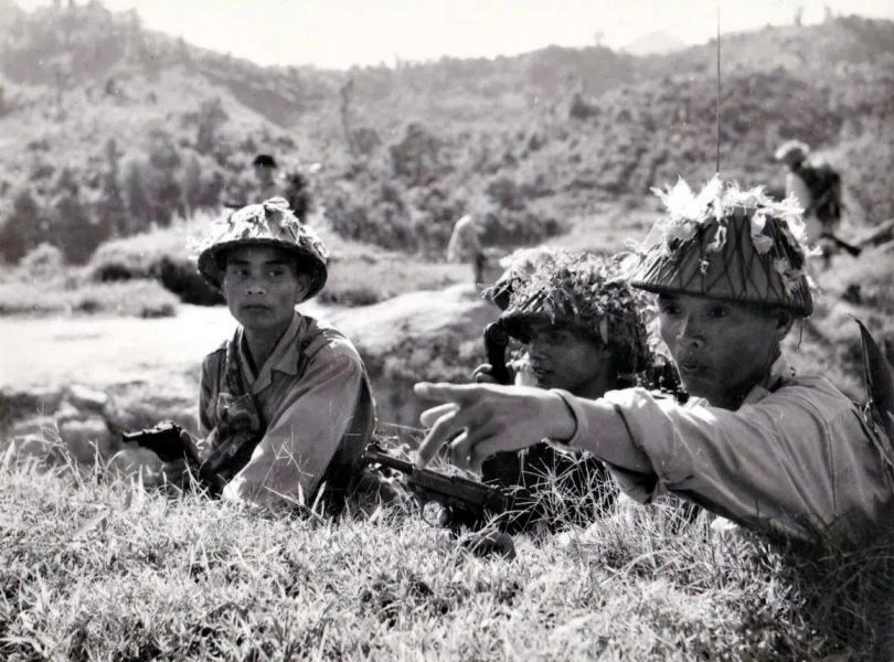 Officers of the PAVN during field maneuvers. They are visibly carrying Walther P38 pistols.