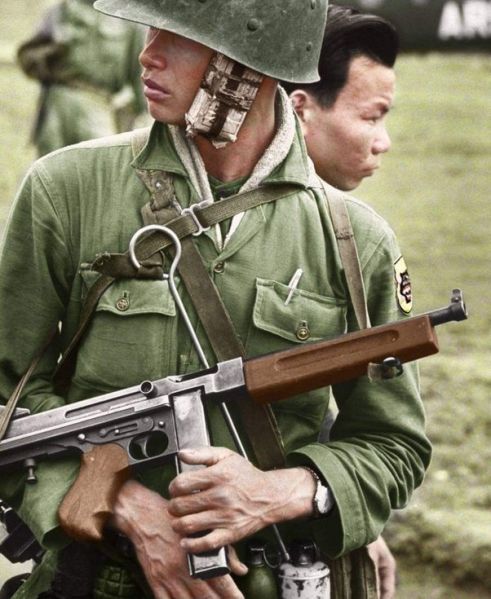 A South Vietnamese soldier in the village of Tia My, armed with a Thompson sub-machine gun, March 1962.